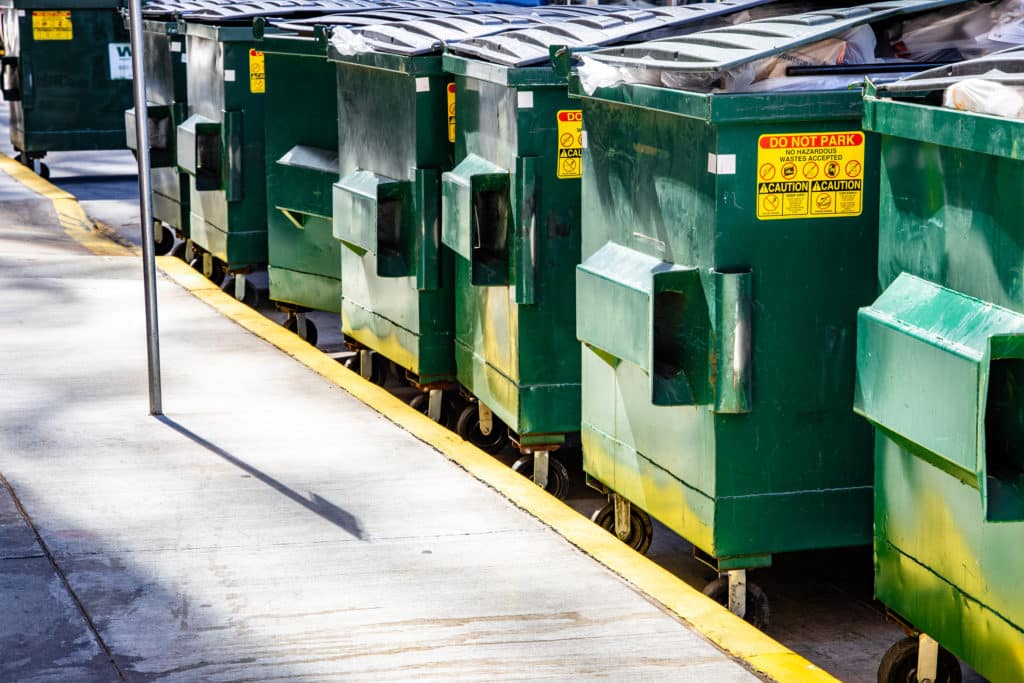 bigstock Dumpsters Lined Up Along A Cit 290217208