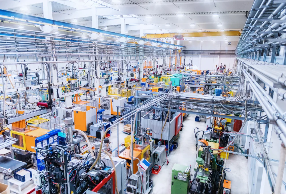 Modern energy-efficient machines operating in a manufacturing plant to minimize energy consumption and costs.