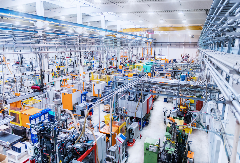 Modern energy-efficient machines operating in a manufacturing plant to minimize energy consumption and costs.