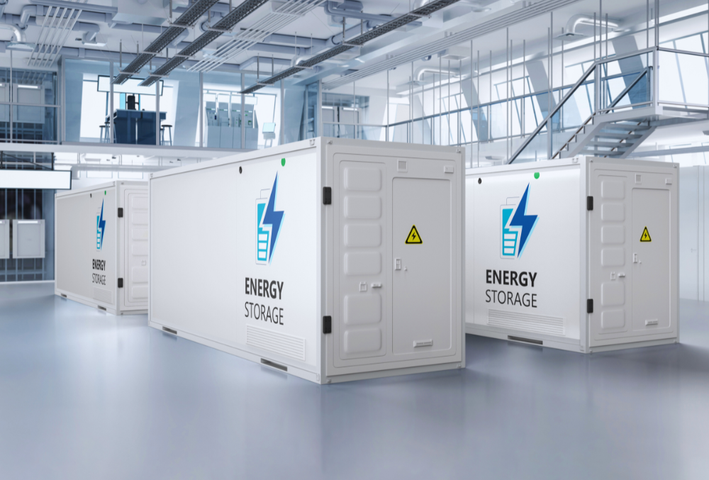 A manufacturing facility equipped with solar panels and wind turbines for sustainable energy savings.